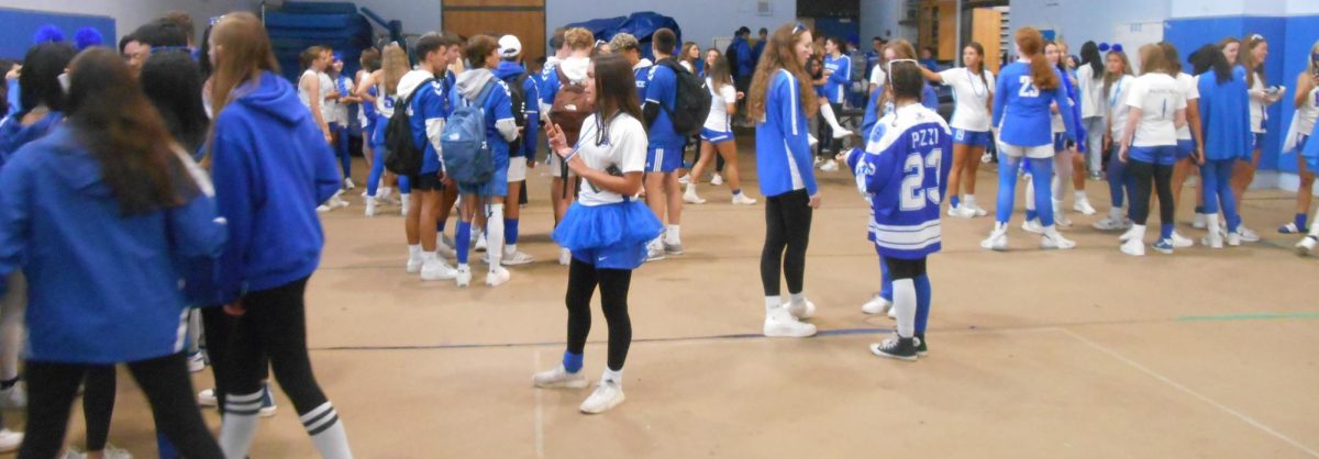 A Large Number of Students Wearing Blue and White Prior to the Pep Rally