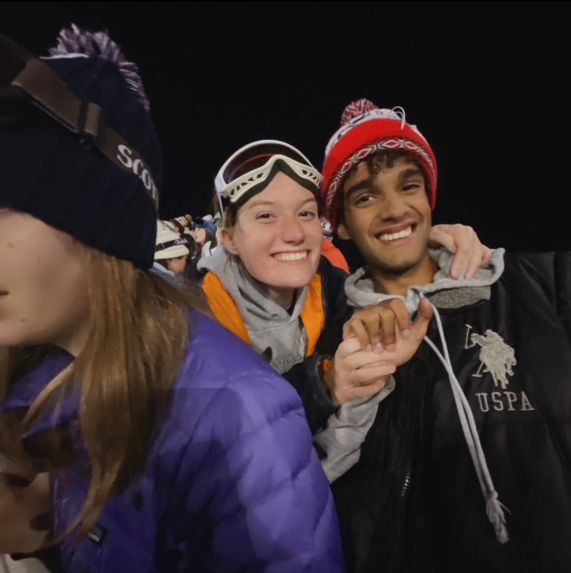 Seniors, Kate Lee and Miles CianiSmith enjoying the game in their ski gear.