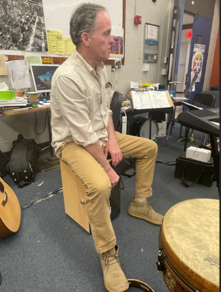 Mr. Buckley, a music teacher at BHS, demonstrates one of the many different ways a cajón can be played.