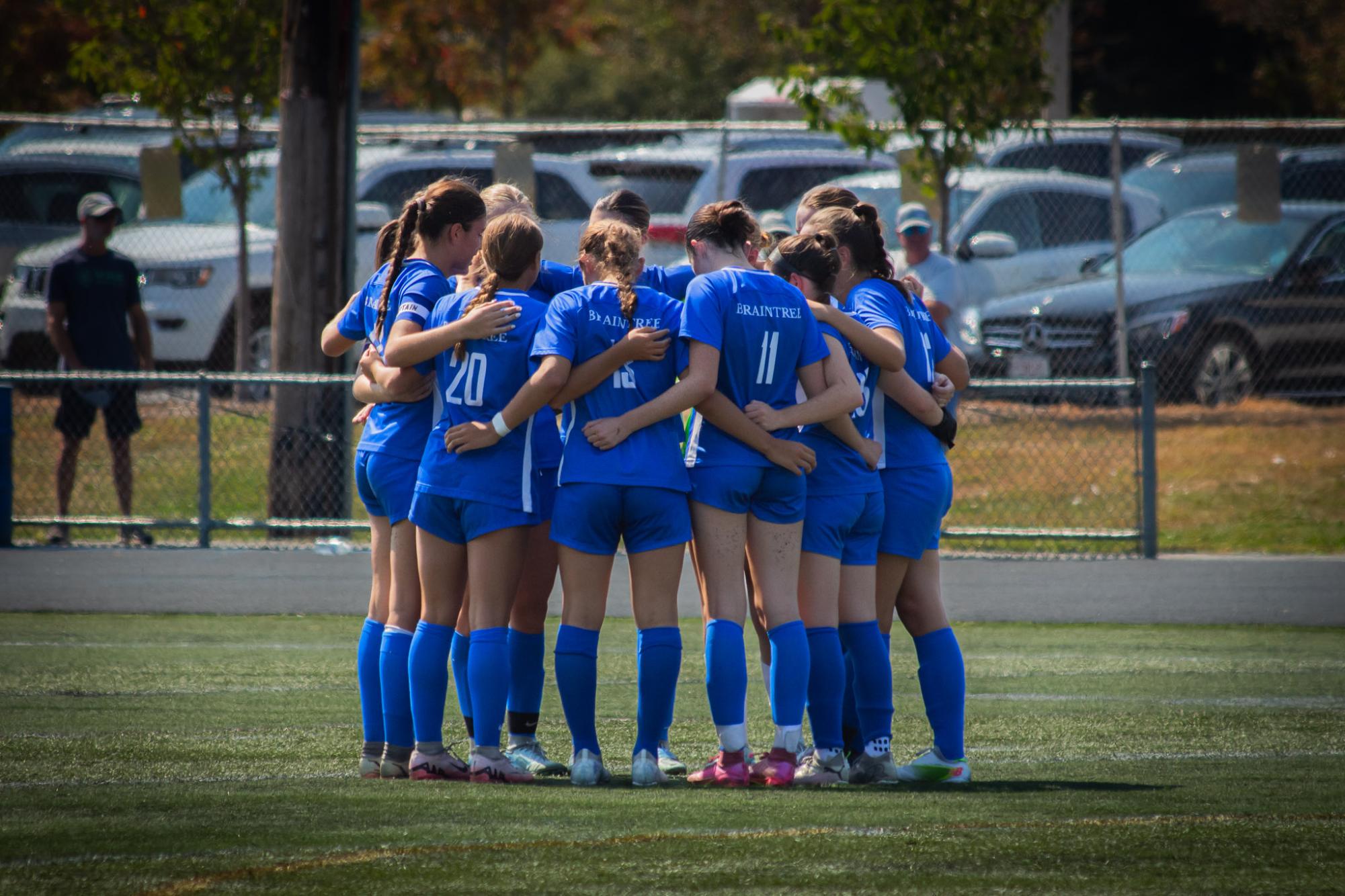 The girls team huddled together before the 2nd half on September 14th, 2024, at Alumni Stadium.