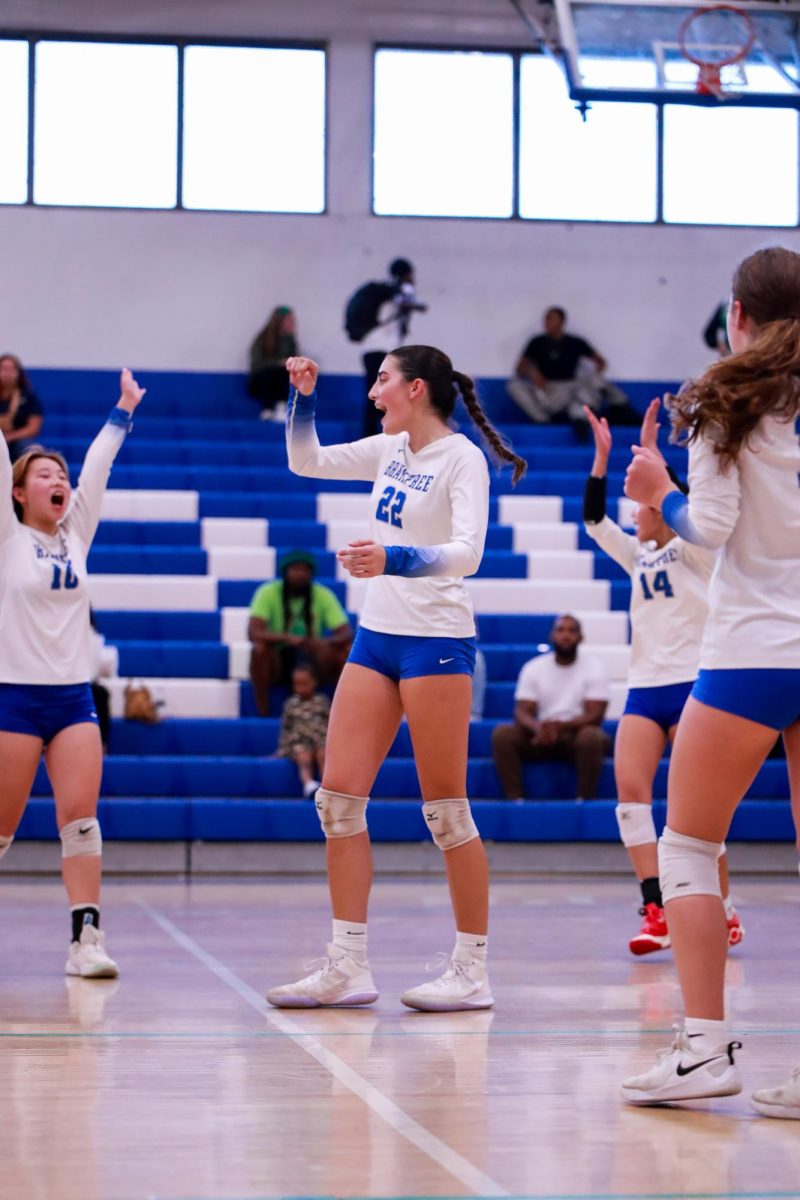 Senior Francesca Spadorcia celebrating a point with her teammates at Hegret gym vs Brockton on September 27.