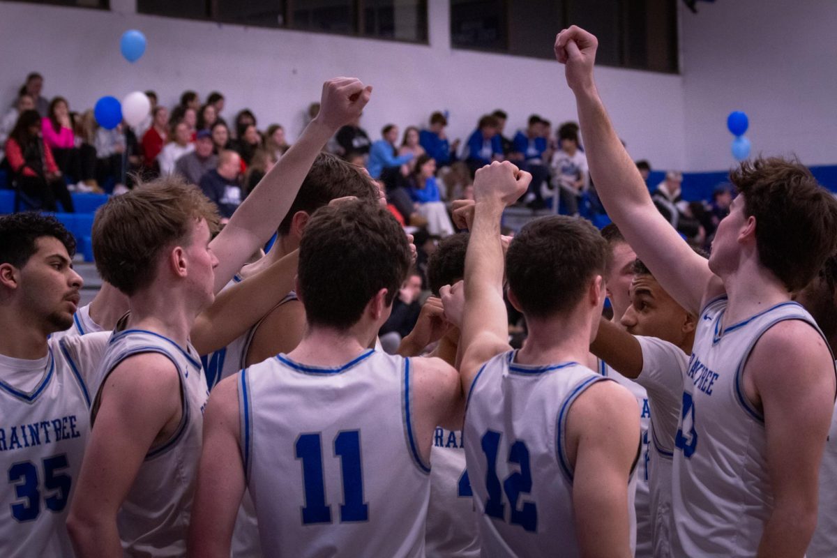 The Braintree Boys Varsity basketball team together for the start of the second half at Herget Gymnasium on February 11th, 2025.