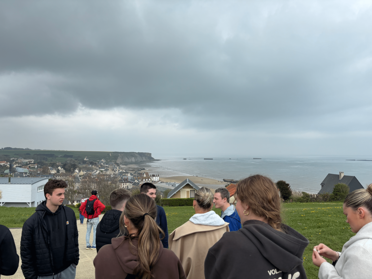 Braintree High students reconvene overlooking a small tourist town in Normandy on the first day in France.
