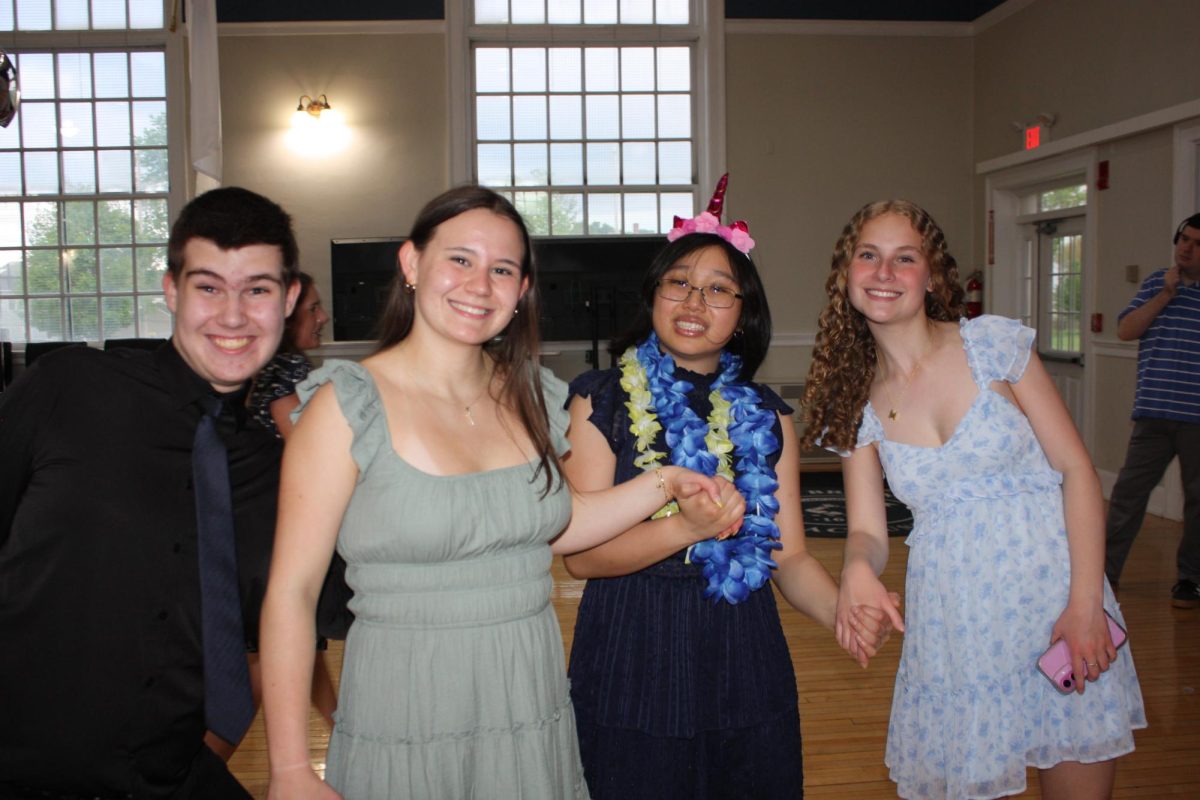 Brooklyn and friendshold hands on the dance floor at Braintree Town Hall on May 9th 2025.