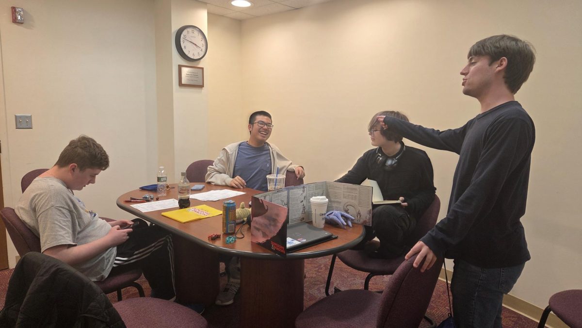 Senior Bram Cass ('25) leads an extra session over the weekend at Thayer Public Library.