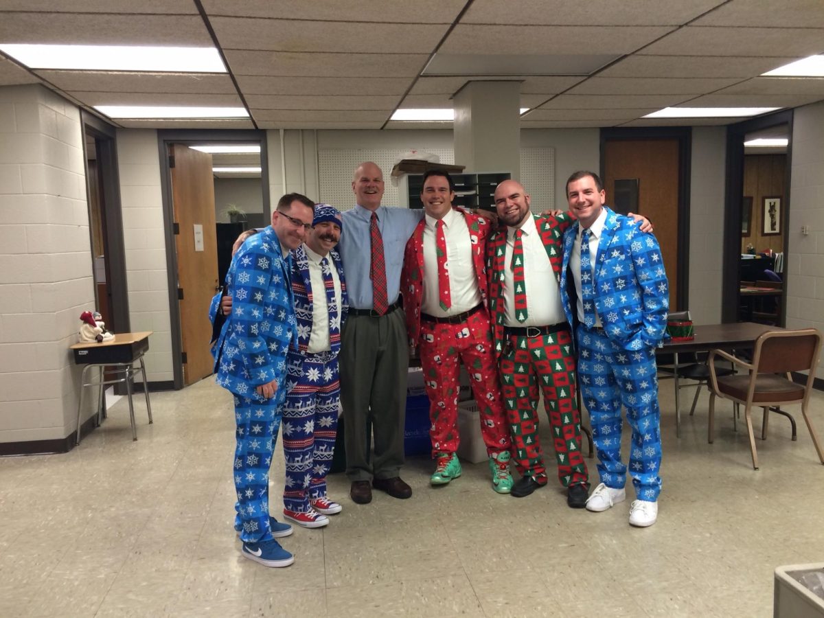 Mike Bochman shares the holiday spirit with the staff of the Braintree High Learning Center.