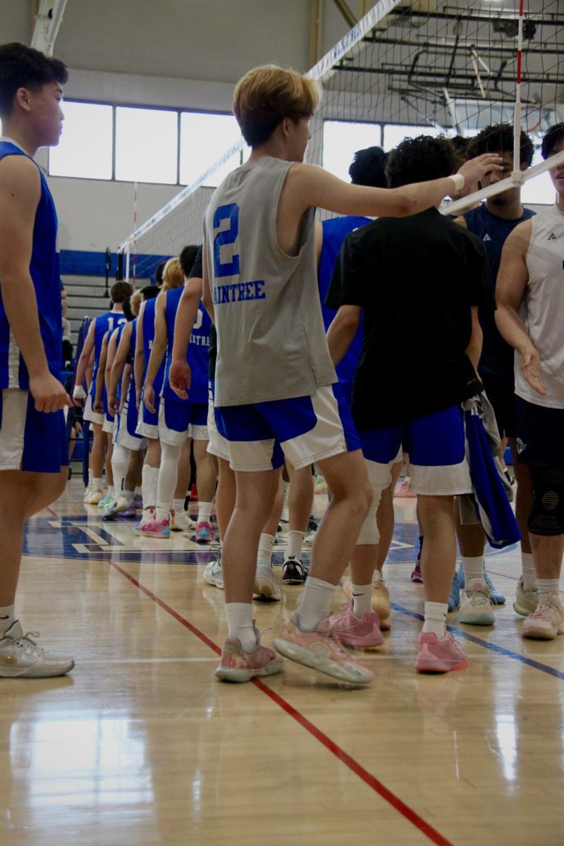 Junior Jo Vu, #2, and the rest of the Braintree team, shake hands with Acton-Boxborough ahead of the 1st round encounter. 