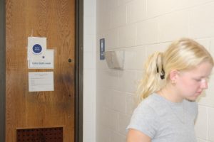 Student walks away from an out-of-order bathroom.