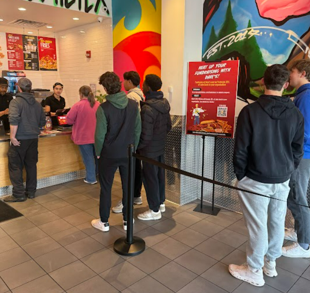 BHS students support the class of 2028 by lining up to order food at Dave's Hot Chicken on November 20th.