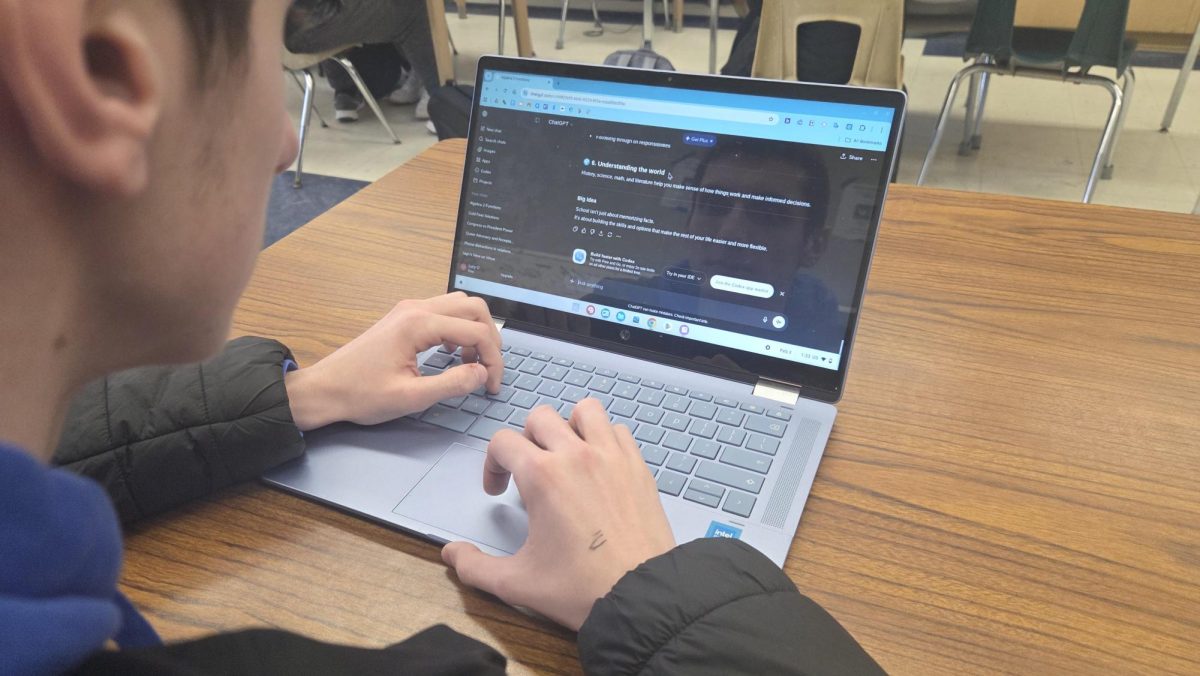Student Angelo Thoyas uses ChatGPT during a free period.