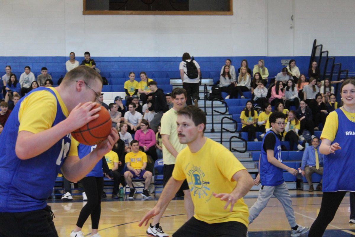 Mr.Mazza blocks Joel Guerrero at the unified basketball game on March 10, 2026 in the Herget gymnasium.