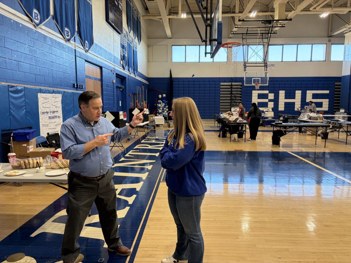 Mr. DiMilla and Ms. Lavoie discuss the blood drive in the BHS gymnasium on Friday, March 13.