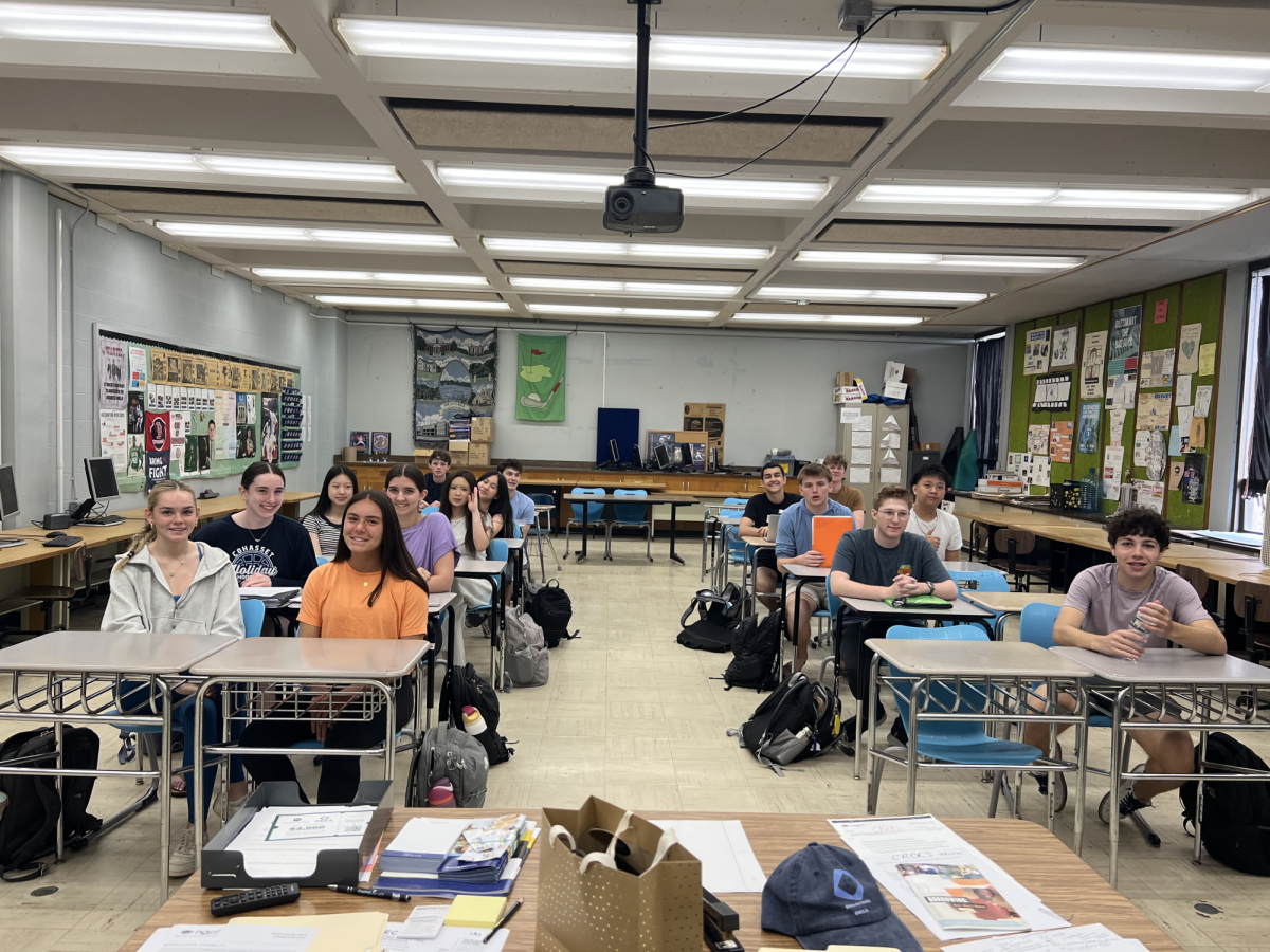 Students in Mr. Belmosto's Intro to Business class pose for a photo.