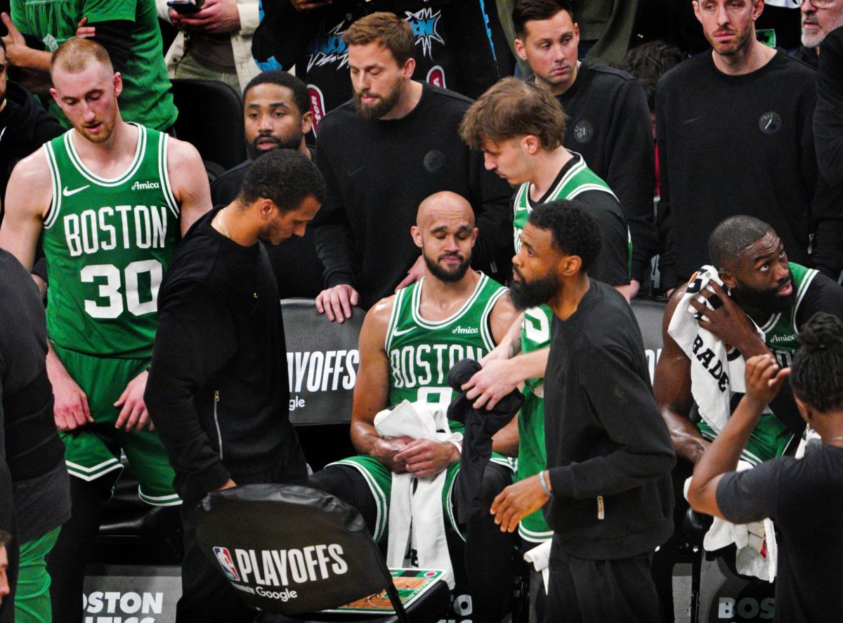 The Cetlics commiserate after their game 7 loss.  Picture from the Boston Globe